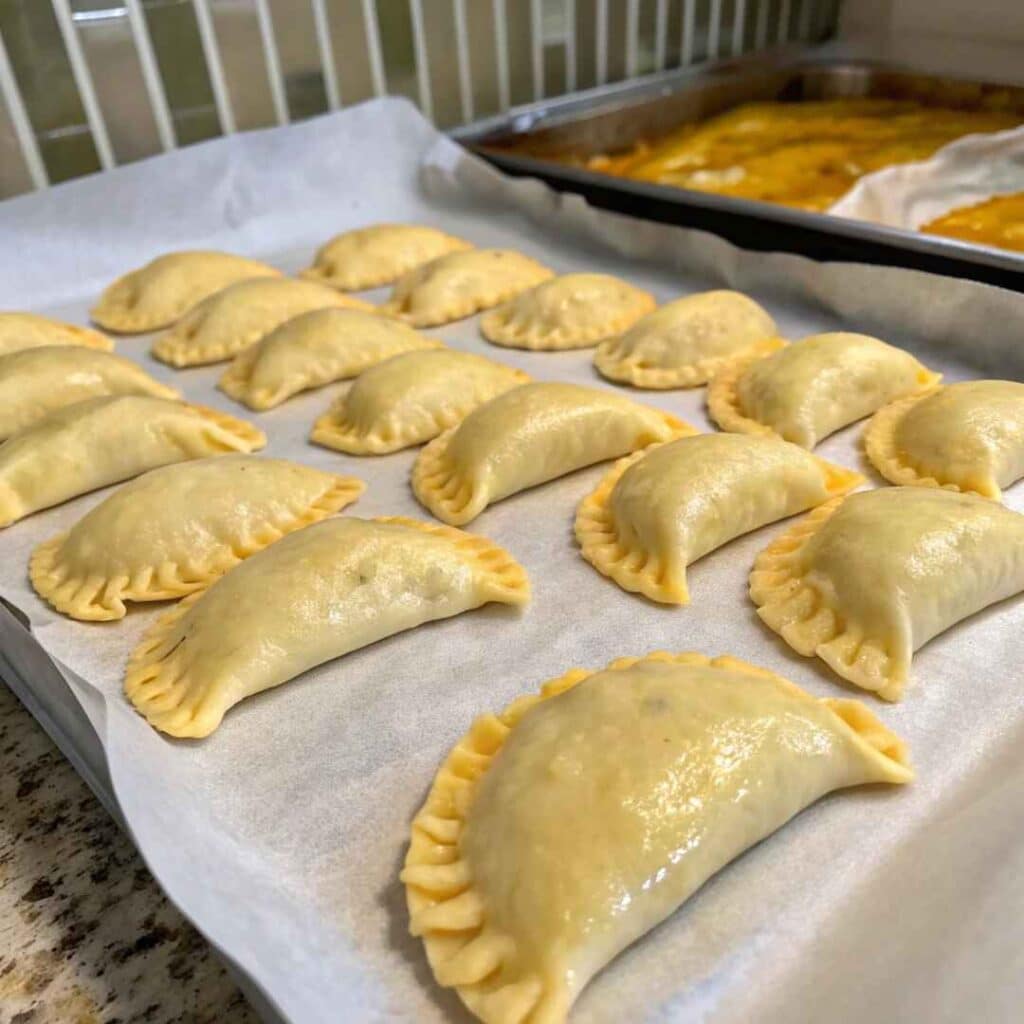 Uncooked air fryer empanadas with egg wash