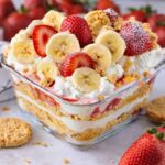 Strawberry cheesecake banana pudding in glass dish