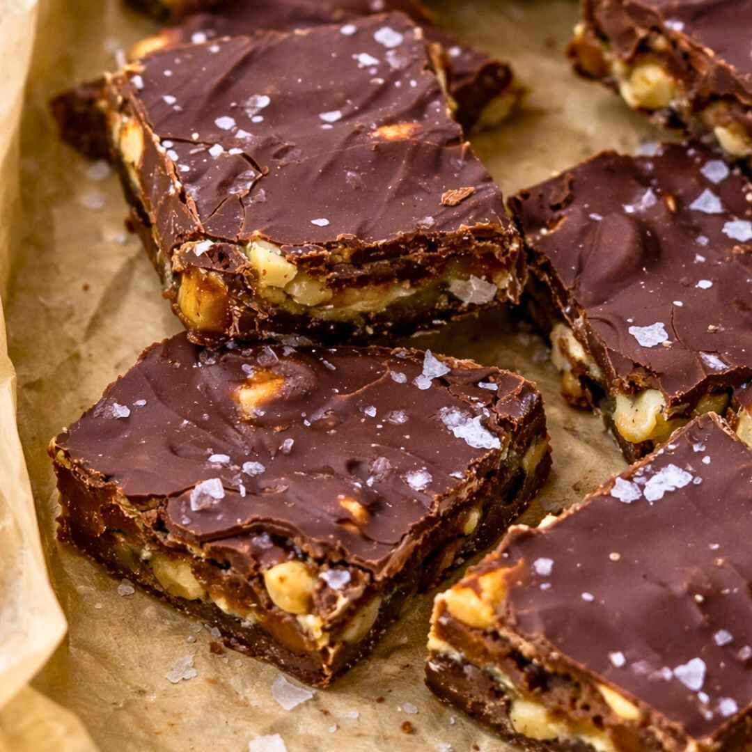Viral Chocolate Date Bark Recipe 6 Chocolate date bark broken into rustic pieces on parchment paper,
