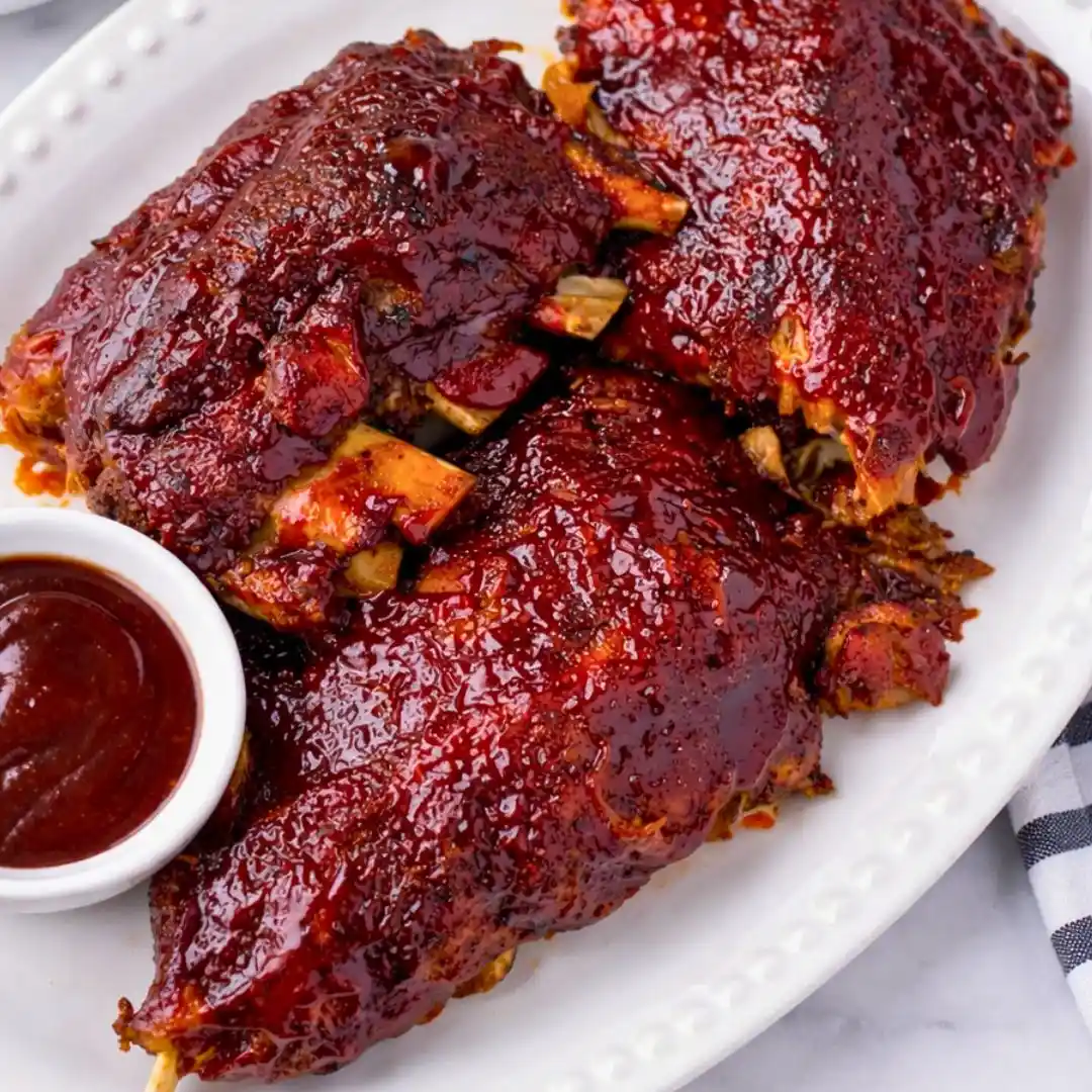 Slow Cooker BBQ Beef Ribs (Tender & Easy Recipe) 5 Tender slow cooker BBQ beef ribs with a sticky caramelized glaze. Easy comfort food perfect for dinner or gatherings.